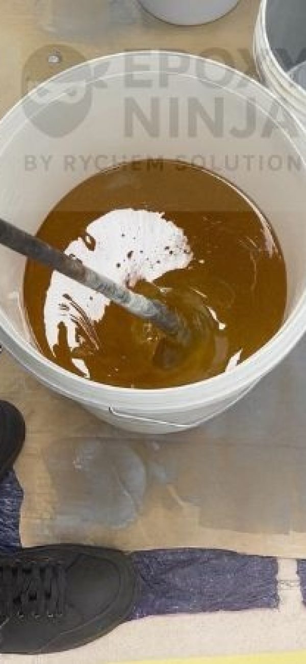 The epoxy primer components are mixed by a low-speed drill (300-400 rpm) and mixing paddle.